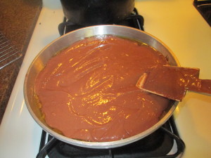 Gently smooth out to the edges, it is okay if it is not perfect, you will see an edge of caramel around the pan.