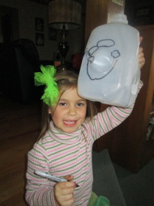 Look at her sweet Jack O Lantern face! I love the drawings of little ones who are just learning to write... so sweet.