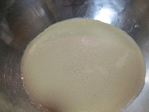 Add 1 Tbsp yeast and 1/4 tsp sugar, sprinkle both over warm water.