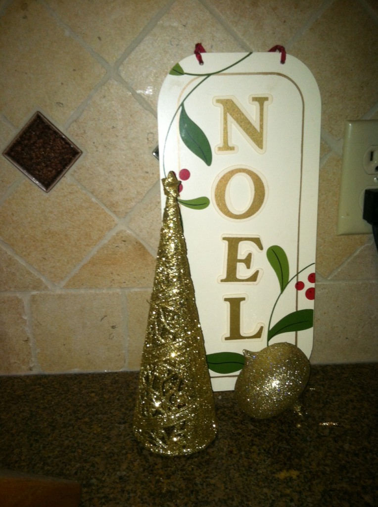 This one is great, I think things look good in threes.  The tree and the sign are from the dollar store, the ornament is one from my mom, Thanks mom!  This is on the counter in the kitchen!  