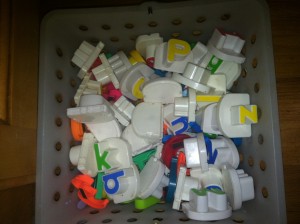 Get all your magnetic letters in a basket or bucket or whatever you have!