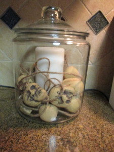 This another super easy one, I love jars, I love to go to thrift stores and buy the jars!  You can use and reuse for so much!  This is just a candle, with the skulls on a string, again from the dollar store!  You can do a few in a row, very fun! 