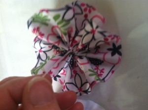 Arrange the ribbon into a  'flower" and tie it tight! Make a few knots!