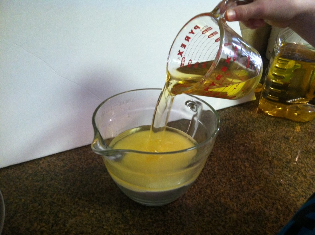 Pour 2 cups of olive oil into 4 cups of sugar.