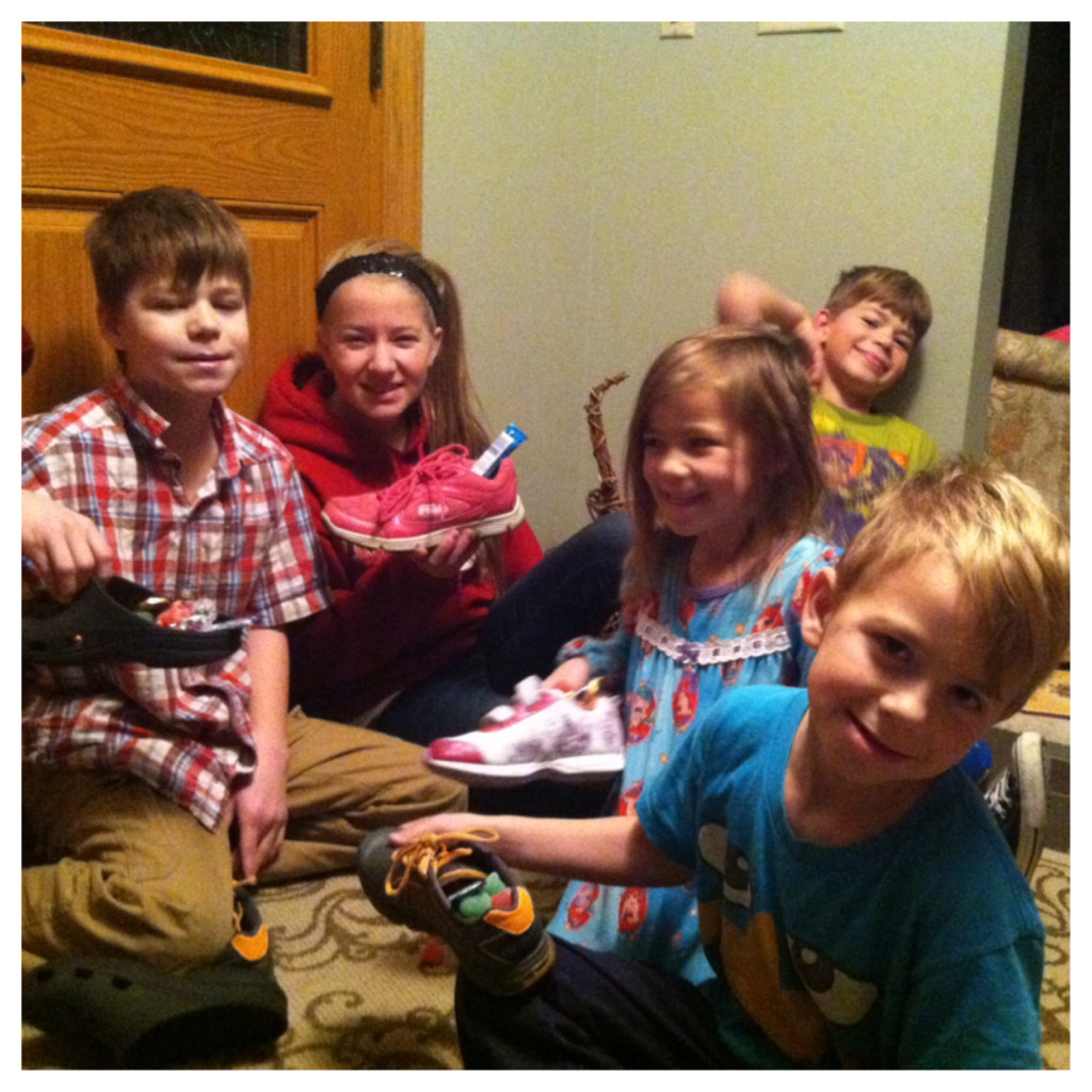 St. Nick came!!  He has just started coming to our house!  This is the second year, he always puts a little candy in the childrens shoes!  Look how rough they all look!  This was a 6 am this morning!  I love it!