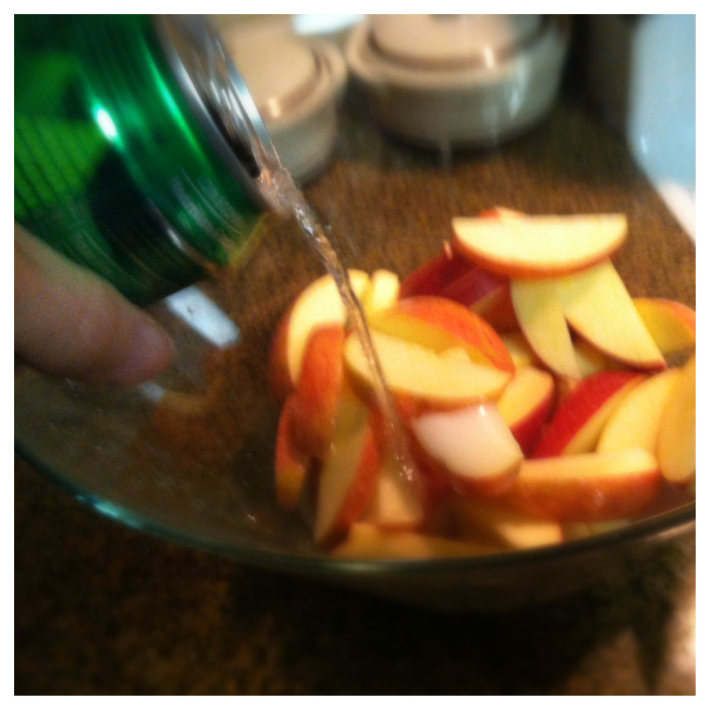 Put your apples in a bowl and cover them with the soda pop.